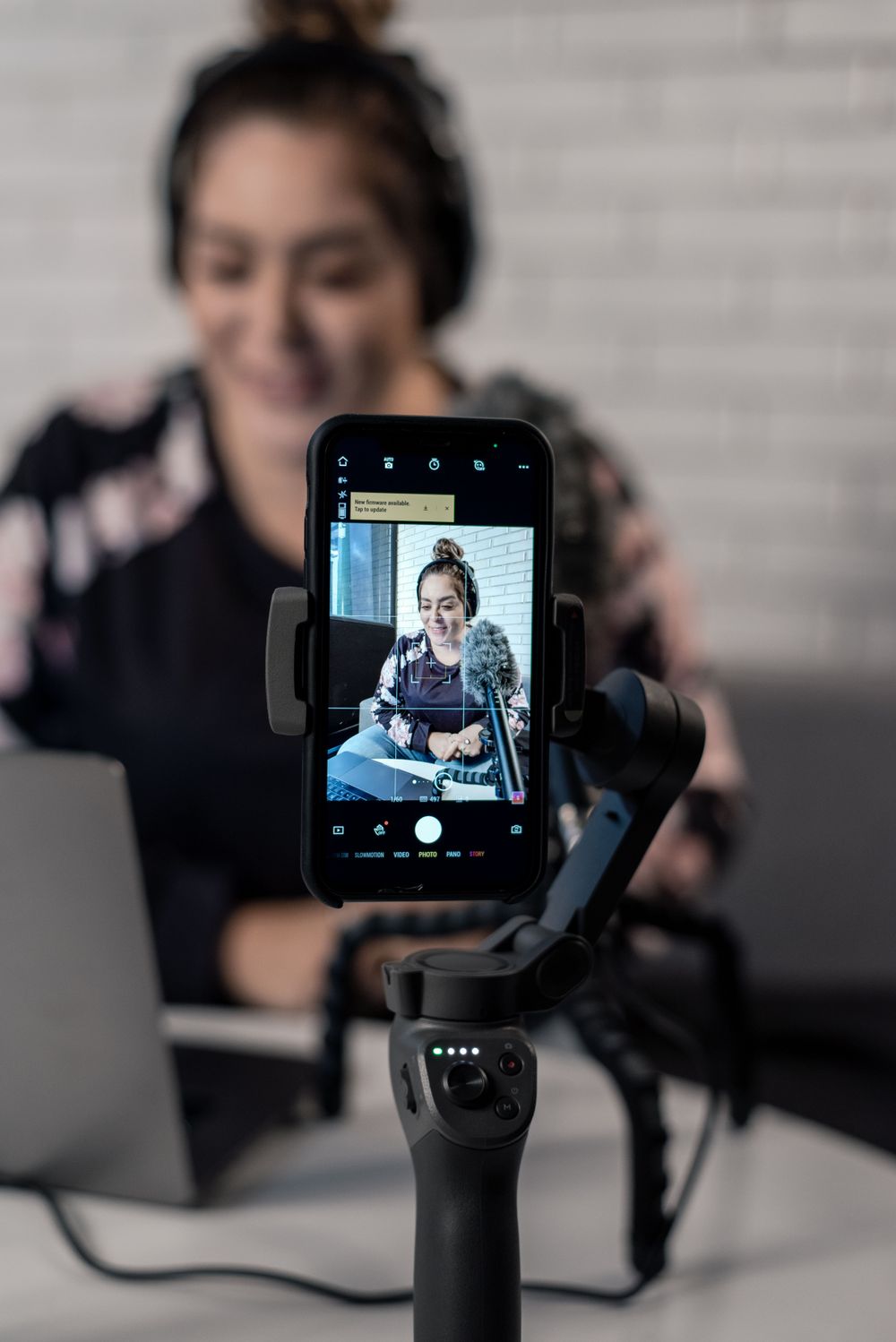 A person filming themselves with a phone — the one-take shoot the generator replaces