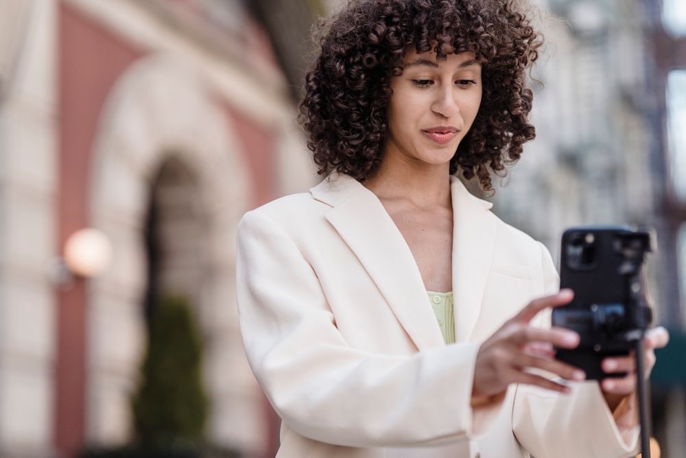 A phone playing a track — the audio side of the trend